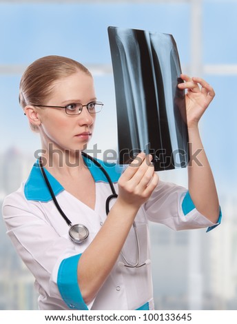 Woman doctor holding an x ray in the hospital