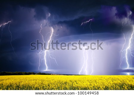 summer storm beginning with lightning Royalty-Free Stock Photo #100149458