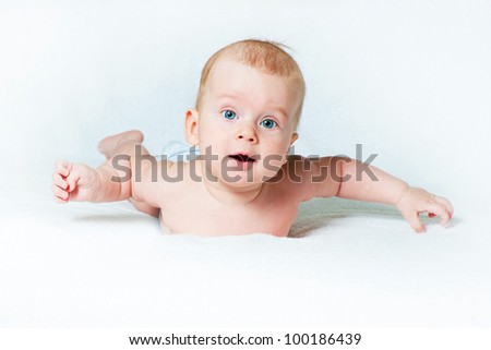 The amusing kid on a light background