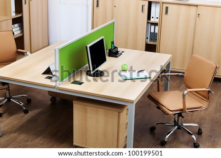 monitor on a desk in a modern office