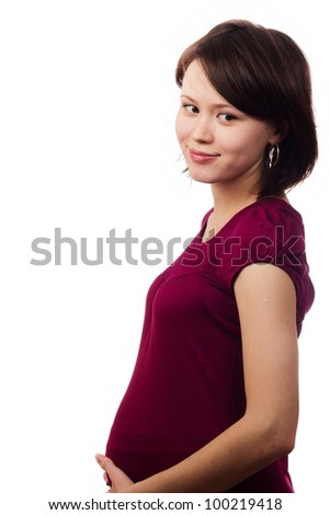 a studio portrait of a beautiful young pregnant woman isolated on white background