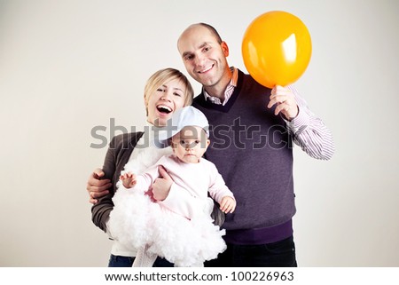An image of a happy family of three