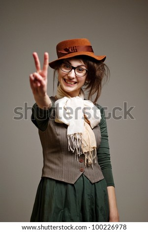 An image of young old-fashioned girl in big glasses