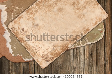 Aged papers on a wooden background