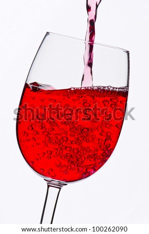 Red wine glass against the light