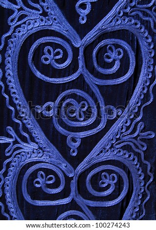 Morocco Detail of a woman's Berber blue intricately embroidered wool Caftan