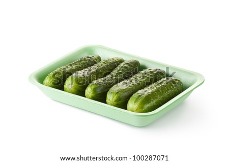 Greenhouse cucumbers in retail packaging. Isolated on a white.