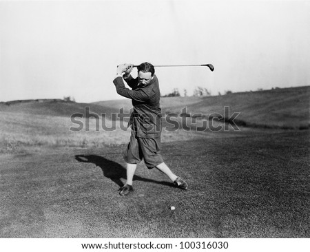 Man playing golf Royalty-Free Stock Photo #100316030