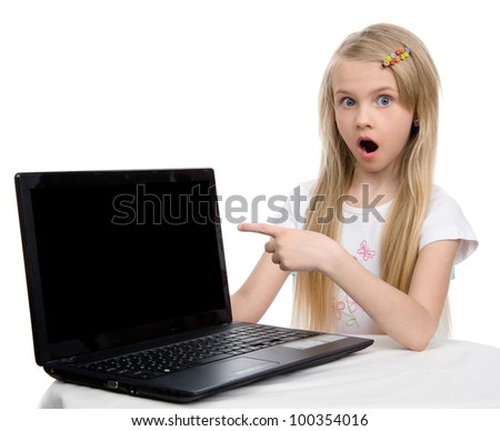 surprised girl pointing to the computer. isolated on white background