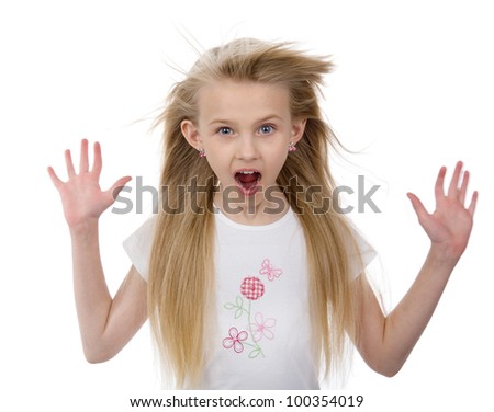 surprised little girl with fluttering hair. isolated on white background