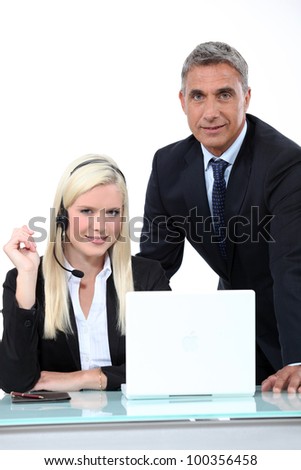Manager talking to an employee in a headset