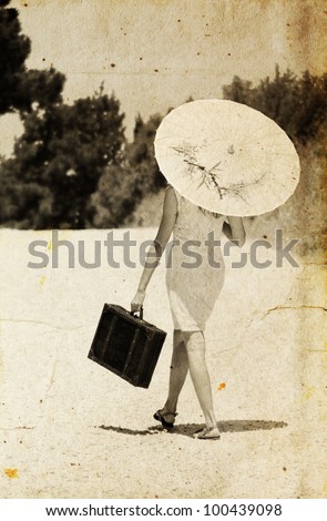 girl with a briefcase and a Japanese umbrella. Photo in old color image style.
