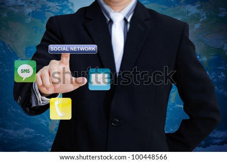 Businessman pushing social network icon for communication