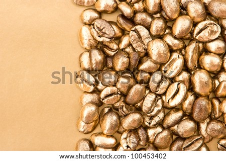 golden coffee beans on golden background