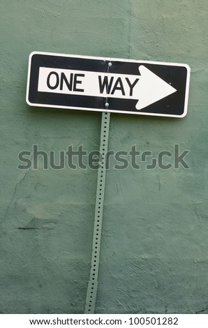 A interesting one way sign in a city alley