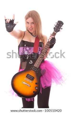 passionate woman guitarist playing the guitar and making a rock sign
