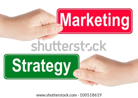 Strategy and Marketing traffic sign in the hand on the white background