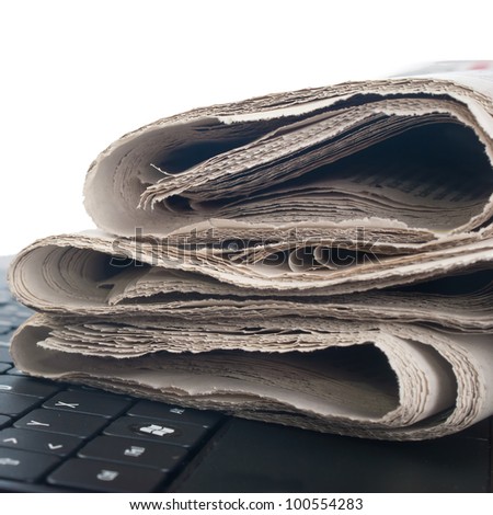close up photo of newspaper on the keyboard