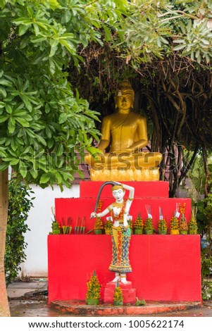 A view of the golden statue of Buddha, Luang Prabang, Laos. Vertical