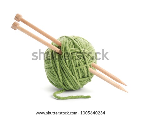 Ball of thread and knitting needles on white background Royalty-Free Stock Photo #1005640234