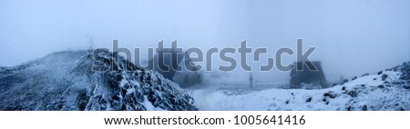 Panoramic picture of Chatka Puchatka on Polonina Wetlinska in Bieszczady Mountains. Mountain shelter in frozy winter evening scenery.