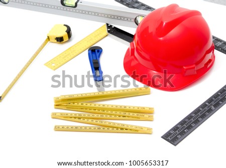 Photo of the Helmet and tools for construction drawings and buildings, industrial concept.