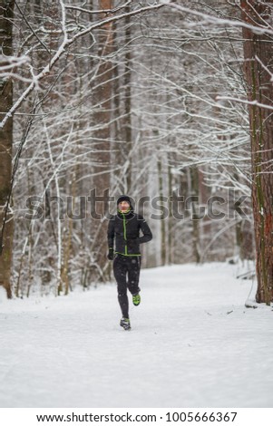 Photo of young athlete on run in winter