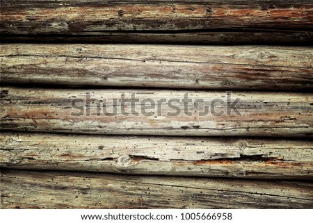 Old plank wooden wall background. The texture of old wood. Weathered piece of wood.