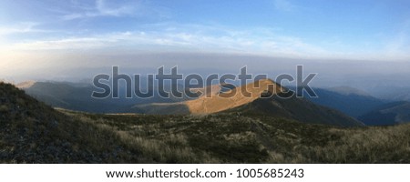 Panoramic view high in the mountains in summer in the dawn