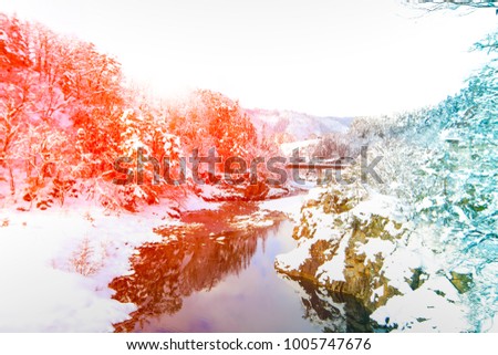 snow landscape mountains trees and river for natural background.