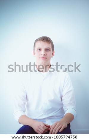 Young business man working in office ,standing . Young business man