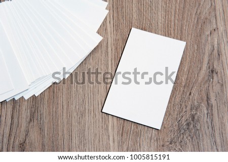 Blank business cards on wooden floor. High size mockup