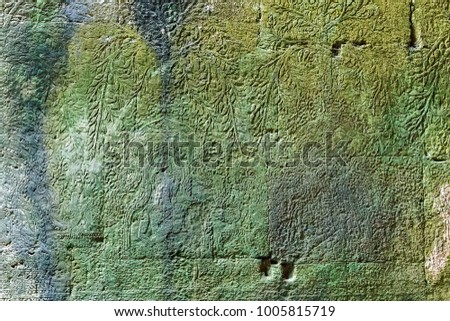 Detail of carvings background Bas-Relief Statue of Khmer Culture in Angkor Wat, Cambodia