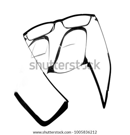 A pair of bi-focal optical glasses taken in isolation in high key against a white background