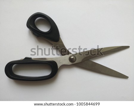 Black scissors isolated on a white background Royalty-Free Stock Photo #1005844699