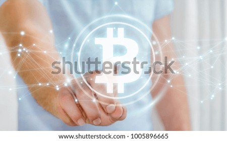 Businessman on blurred background using bitcoins cryptocurrency 3D rendering
