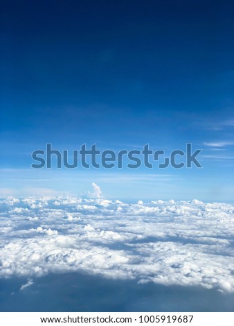 Top View of Blue Sky with White Mostly Cloud form the Plane in the Air, the Atmosphere of the Earth