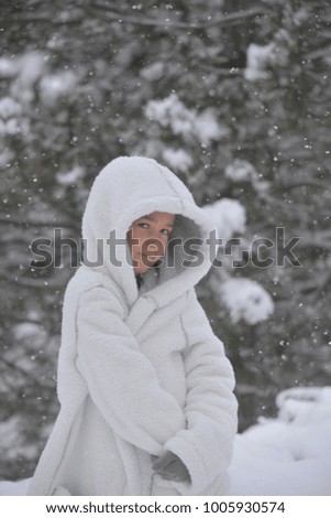 Little boy outside in the snow