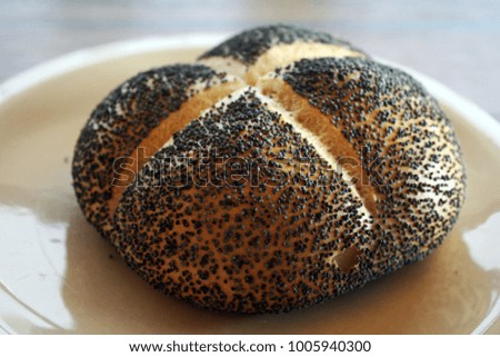 Freshly flavored bun with poppy seeds for breakfast