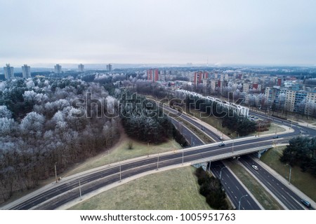 Aerial view over interchange roads in Karoliniskes district, Vilnius, Lithuania. During frosty winter daytime.