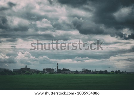 Suburban industrial landscape under a beautiful cloudy sky