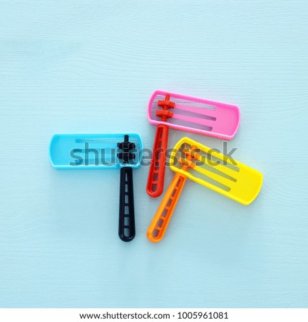 Purim celebration concept (jewish carnival holiday). Top view of noise maker traditional toy