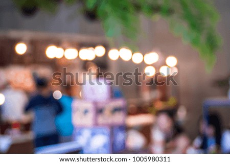 Defocused or blured restaurant with people abstract bokeh light background for dinner to relax.