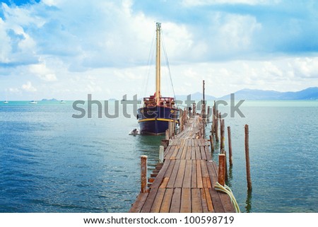 Samui view - boat and wooden bridge in the sea
