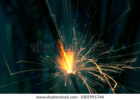 Christmas sparkler fire in dark closeup