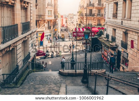 Typical Montmartre staircase and entrance to Paris Metro subway in Paris, France. Architecture and landmarks of Paris. Postcard of Paris Royalty-Free Stock Photo #1006001962