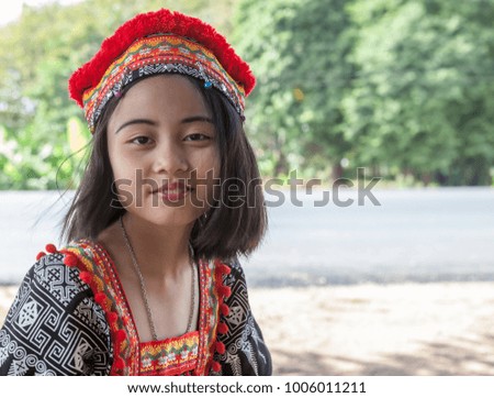 Thai girl play around whit traditional Thai costume