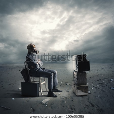 businessman with gas mask watching TV Royalty-Free Stock Photo #100605385
