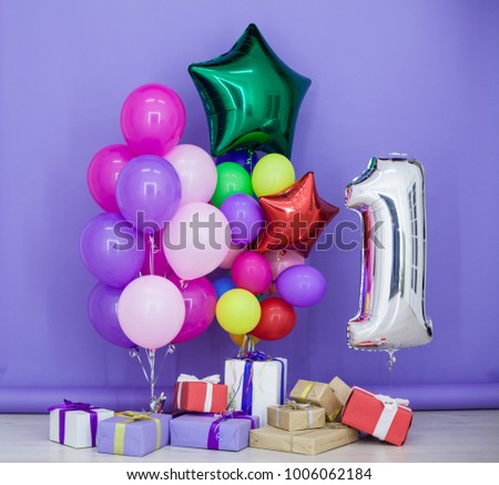 balloons of different colors and birthday gifts for the holiday