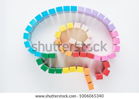 Human brain is made of multi-colored wooden blocks. Top view, flat lay. Royalty-Free Stock Photo #1006065340